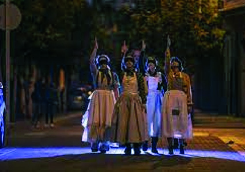 Four women walking down the street